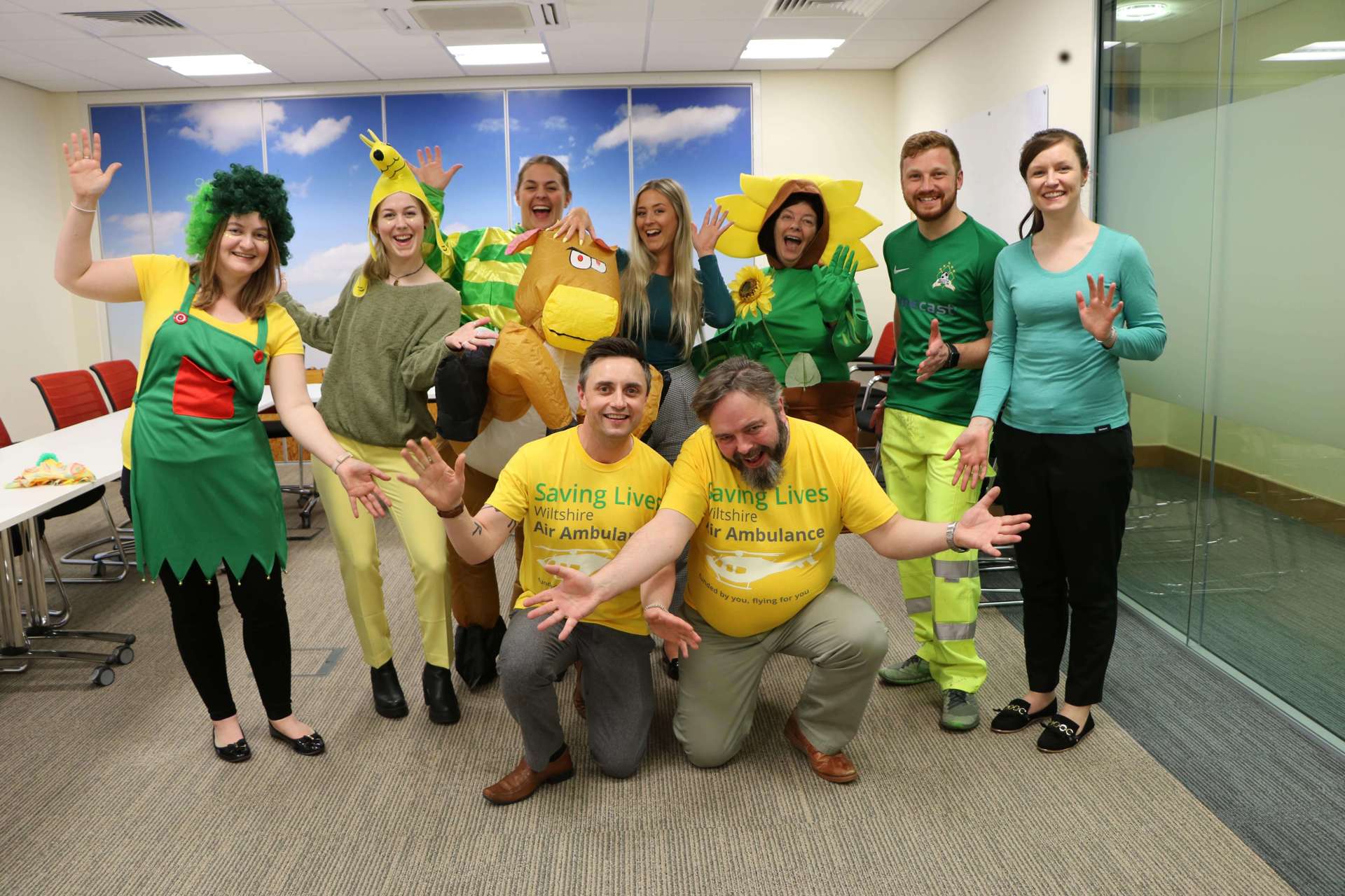 A group of colleagues wearing green and yellow attire to raise funds for Wiltshire Air Ambulance during Air Ambulance week. A group of colleagues wearing green and yellow attire to raise funds for Wiltshire Air Ambulance during Air Ambulance week.