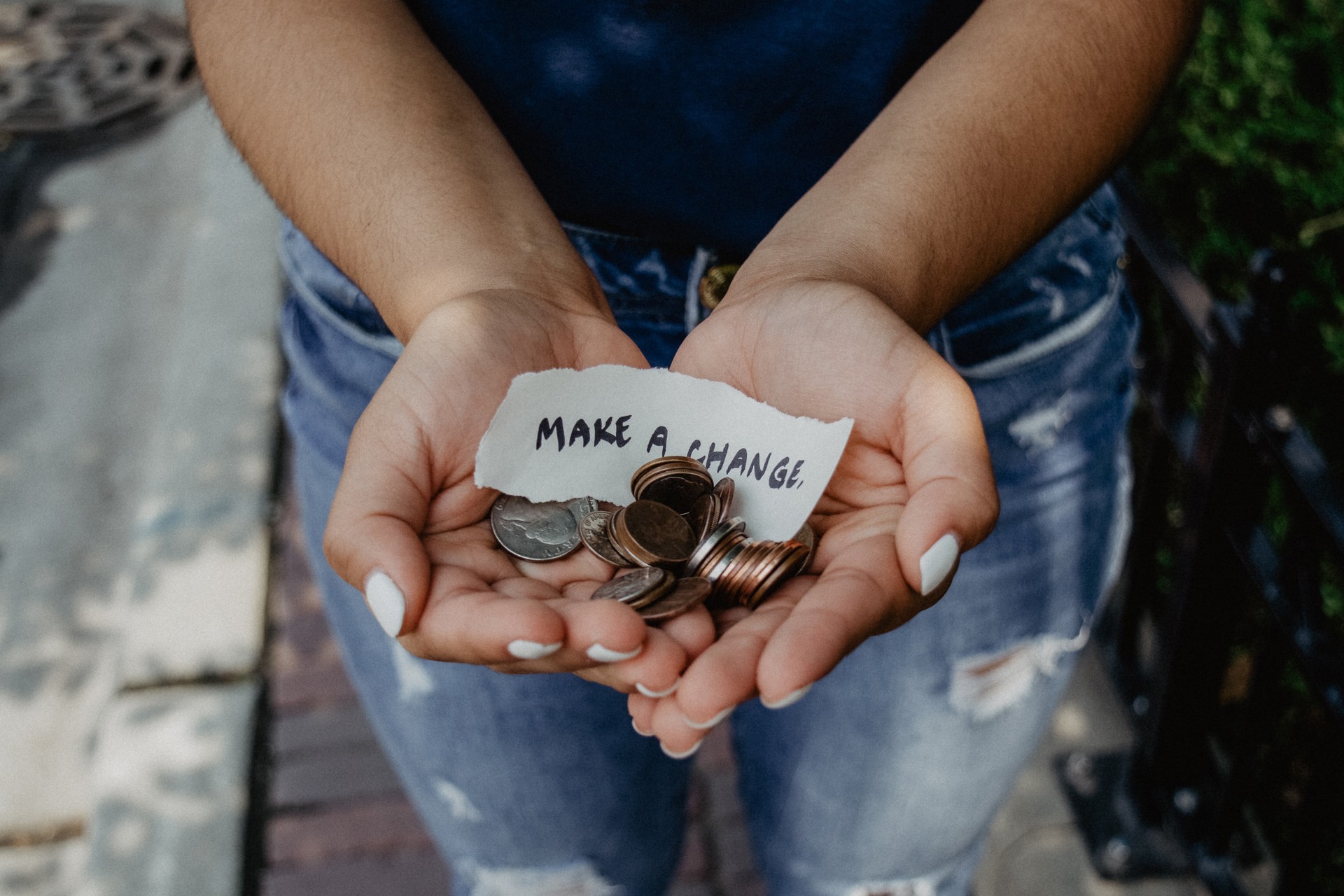 A small handwritten note stating 'make a change' with a variety of coins. A small handwritten note stating 'make a change' with a variety of coins.