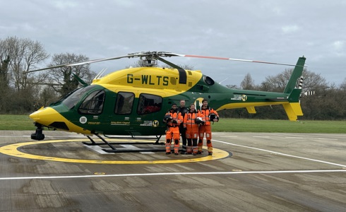 Wiltshire and Bath Air Ambulance Charity's new look helicopter, back at it's airbase in Semington, with four members of the critical care team standing beside it Wiltshire and Bath Air Ambulance Charity's new look helicopter, back at it's airbase in Semington, with four members of the critical care team standing beside it