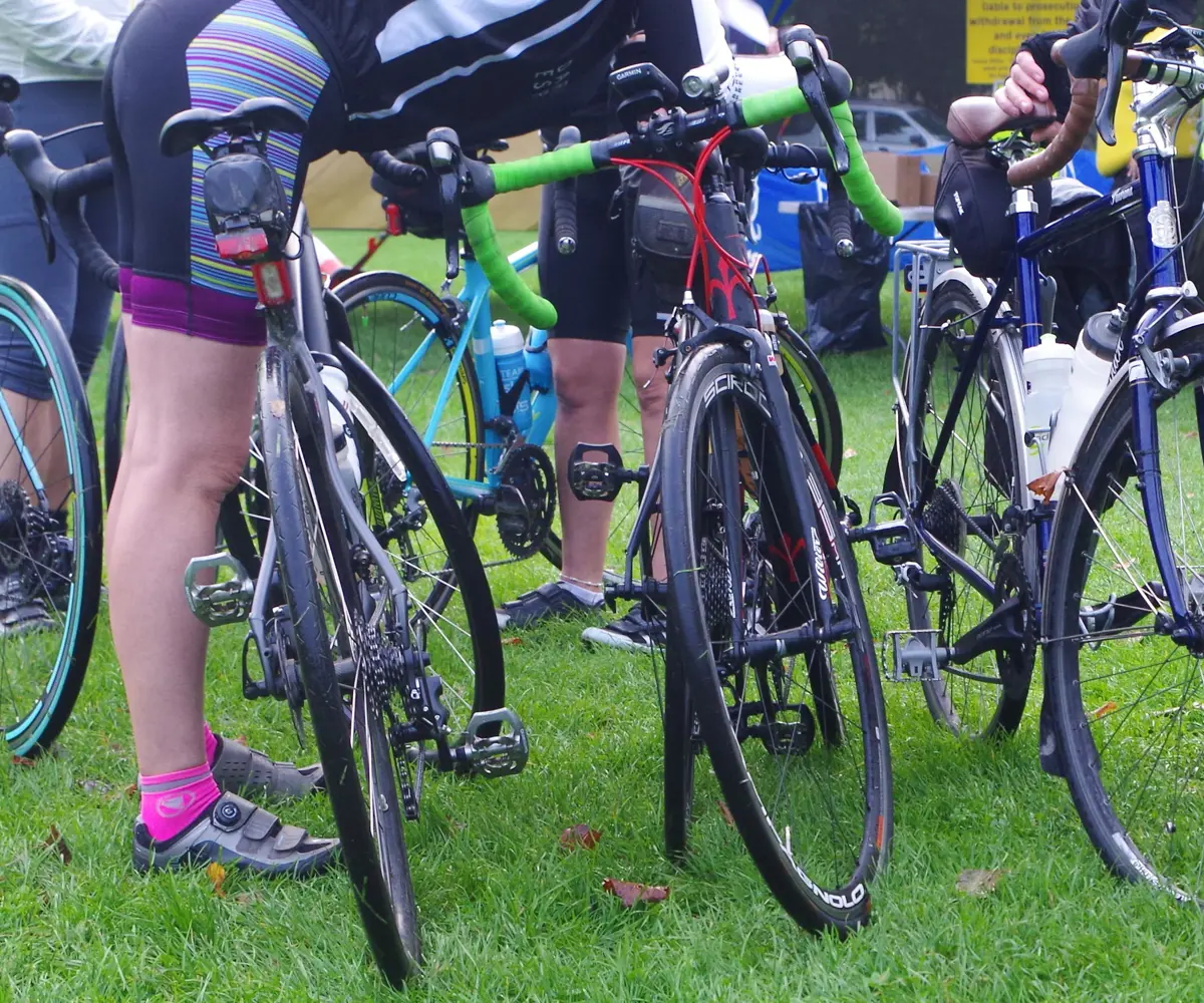 A photo of road bikes and cyclists at an event