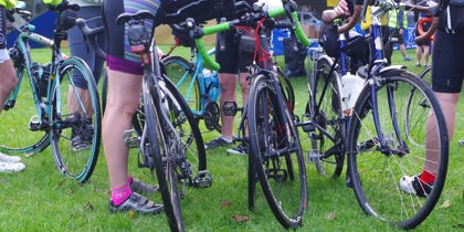 A photo of road bikes and cyclists at an event