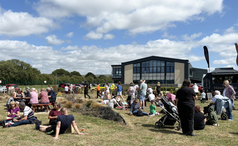 A group of people lounging in the sun at an air ambulance airbase A group of people lounging in the sun at an air ambulance airbase