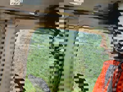 Dr Jono Holme admiring the view of green fields and tress from the Wiltshire Air Ambulance helicopter Dr Jono Holme admiring the view of green fields and tress from the Wiltshire Air Ambulance helicopter