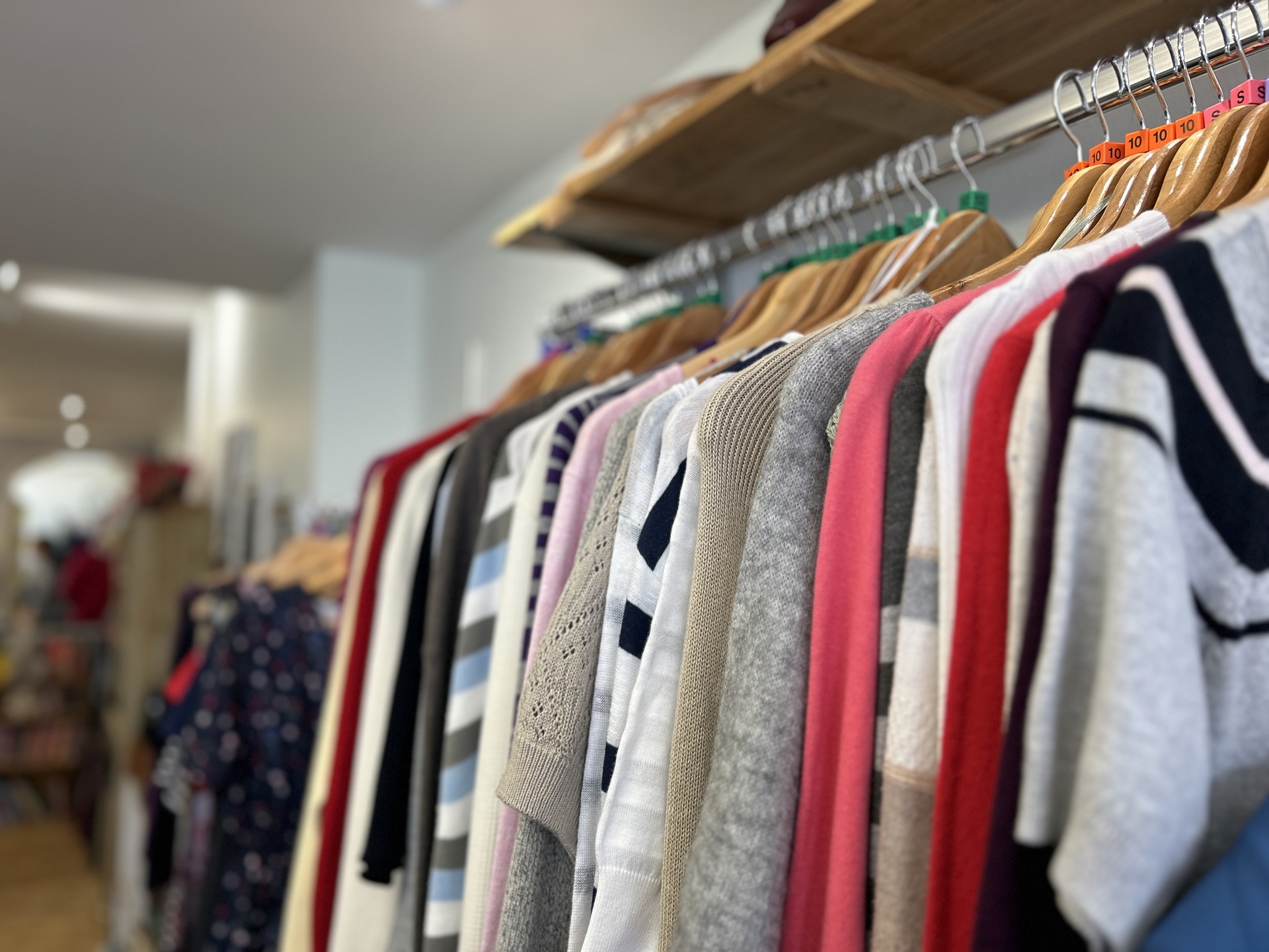 A rail of clothing for sale in the Devizes Charity Shop A rail of clothing for sale in the Devizes Charity Shop
