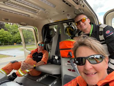 Critical care paramedic Emma Thompson sat in the back of the Bell-429 helicopter alongside pilot Fin Collins and fellow paramedic Lou Cox Critical care paramedic Emma Thompson sat in the back of the Bell-429 helicopter alongside pilot Fin Collins and fellow paramedic Lou Cox