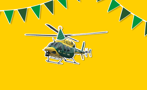 A yellow background with a sticker of the yellow and grey Bell 429 helicopter wearing a cartoon sticker hat, with green bunting around it