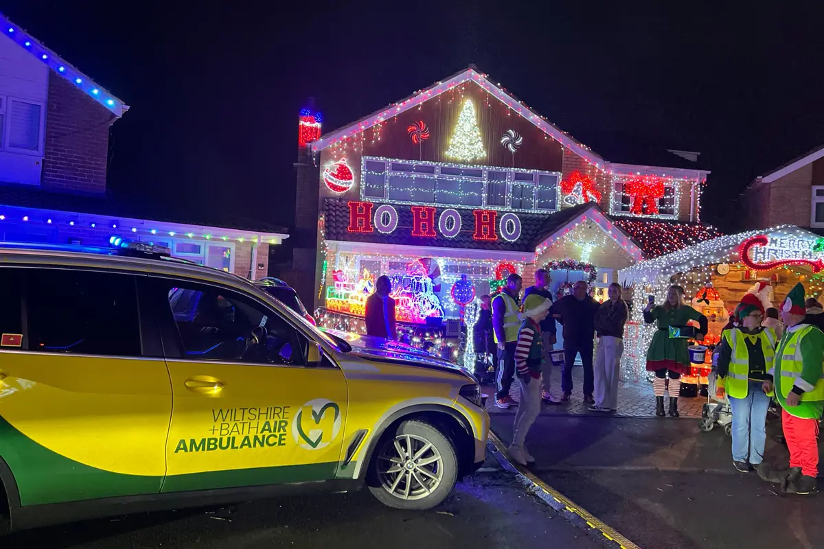 Yellow and green Wiltshire and Bath Air Ambulance critical care car at Sarum Avenue Christmas lights in Melksham