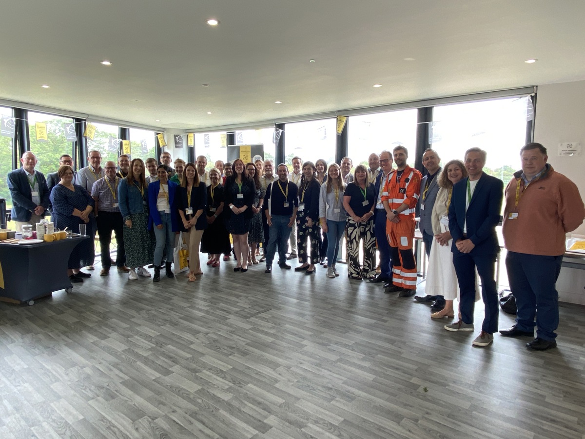 A large group of people smiling at the camera for the launch of The Business Club A large group of people smiling at the camera for the launch of The Business Club