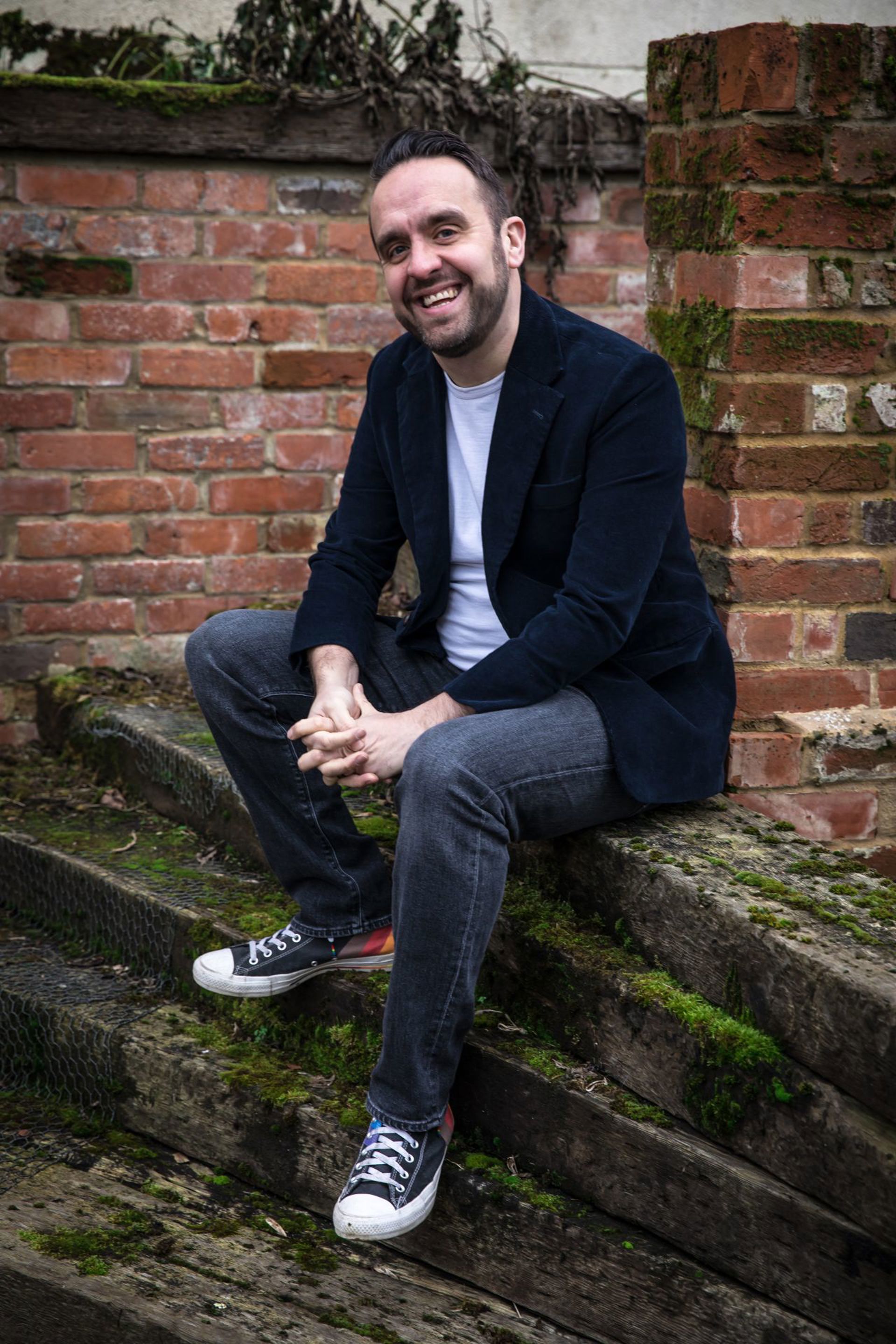 Dave Plunkett sat on stone steps Dave Plunkett sat on stone steps