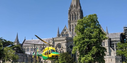 Wiltshire Air Ambulance taking off from Salisbury Cathedral