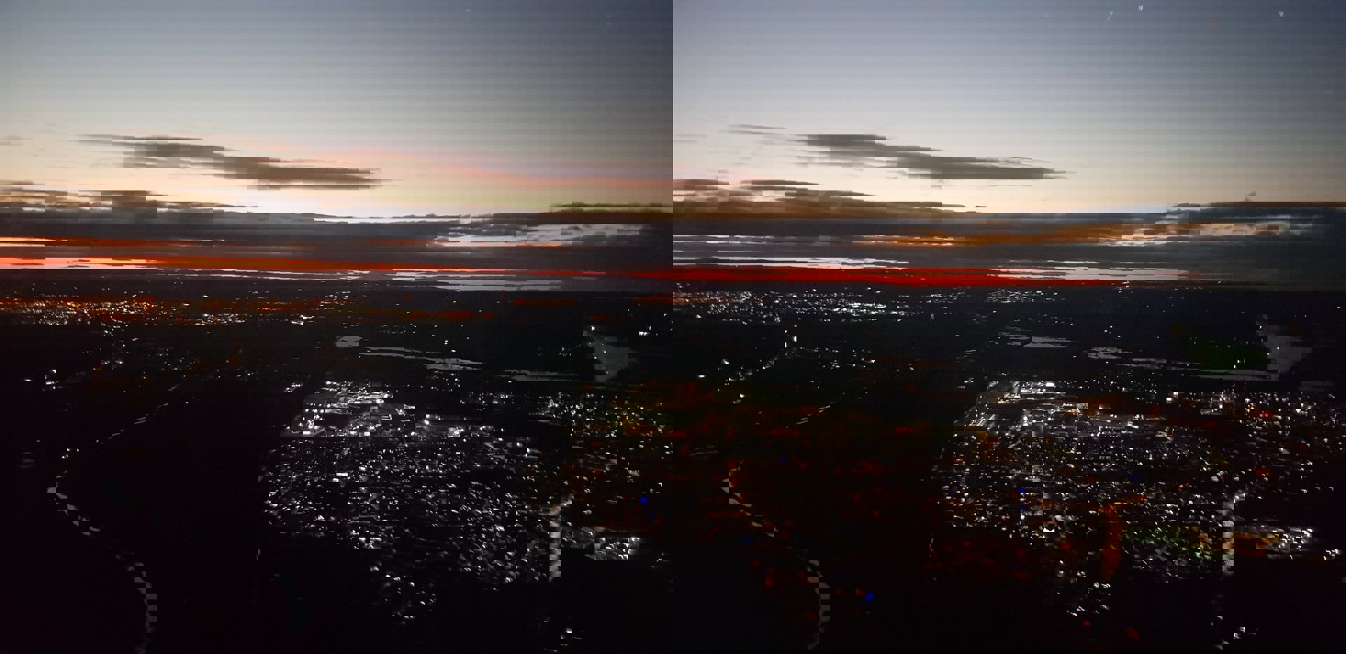 A photo of a town from above with a sunset A photo of a town from above with a sunset