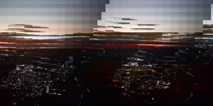 A photo of a town from above with a sunset A photo of a town from above with a sunset