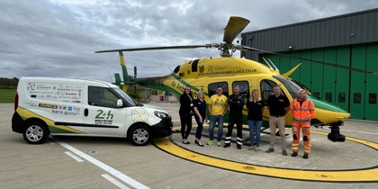 Mike Land with the 24hr van pull vehicle parked on the helipad next to the WAA helicopter Mike Land with the 24hr van pull vehicle parked on the helipad next to the WAA helicopter
