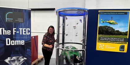 A fundraising activity involving an air dome where participants collect fake cash A fundraising activity involving an air dome where participants collect fake cash