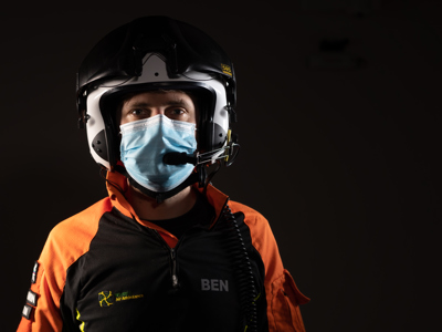 Critical care paramedic Ben Abbott wearing a flight helmet and face mask. Critical care paramedic Ben Abbott wearing a flight helmet and face mask.