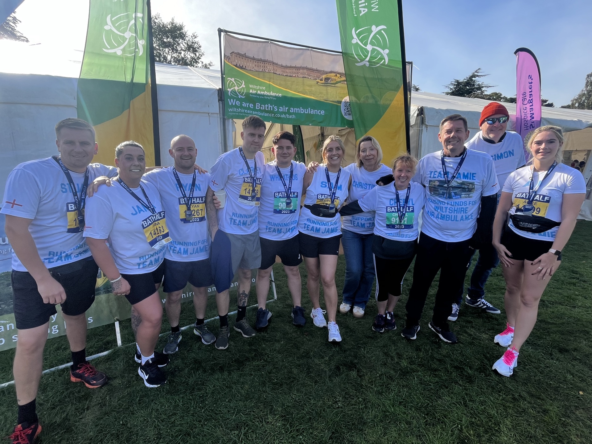 A group of runners with Bath Half Marathon medals A group of runners with Bath Half Marathon medals