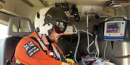 Dr Jono Holme delivering drugs to a patient in flight Dr Jono Holme delivering drugs to a patient in flight