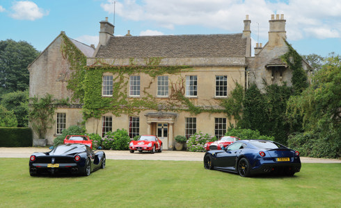 The exterior of Middlewick House, with five sports cars parked on the lawn in front The exterior of Middlewick House, with five sports cars parked on the lawn in front