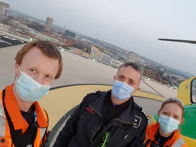 Paramedics Craig and Sophie and Pilot Matt wearing face masks on BRI helipad Paramedics Craig and Sophie and Pilot Matt wearing face masks on BRI helipad