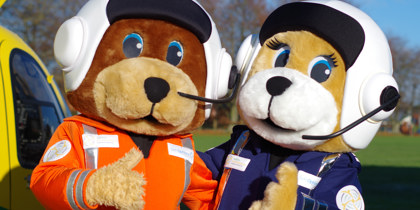 A photo of WAA bear mascots paramedic Wilber and pilot Marsha with their thumbs up