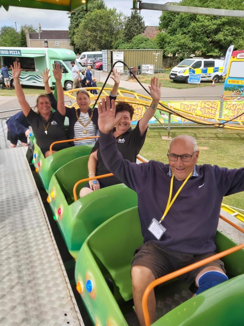 A collection of people on a fairground ride