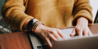 A person typing on a laptop and the option to find out more information about getting your will for free online A person typing on a laptop and the option to find out more information about getting your will for free online